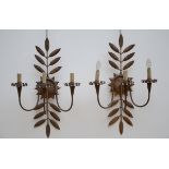 A pair of wall lights in gilded metal (47x72cm)