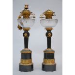 Pair of bronze oil lamps with mechanism (59cm)