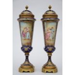 A pair of lidded vases in SËvres porcelain painted by Grisard 'romantic scenes' (50cm)