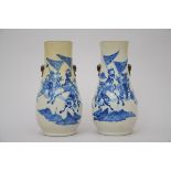 A pair of Nankin vases 'figures' (*) (44cm)