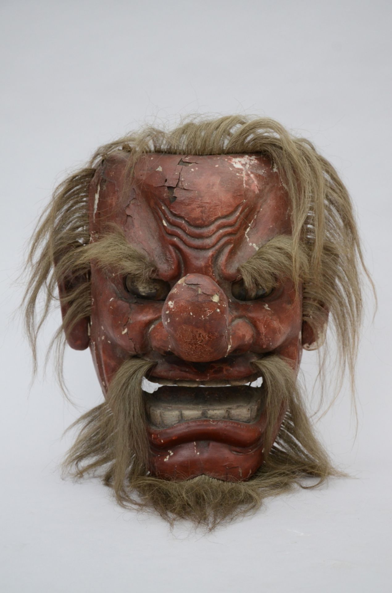 A large Japanese mask in lacquer, 19th century (*) (30x48cm)