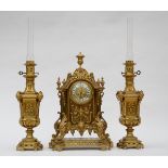 A bronze clock set in Henri II style
