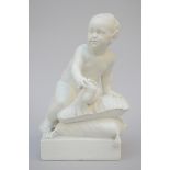 Coustou: a bisque statue 'young boy on a pillow' (42cm)