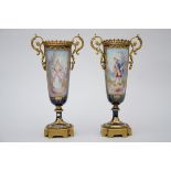 A pair of vases in SËvres porcelain 'galant couple' (*) (35cm)