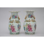 A pair of famille verte vases in Canton porcelain 'scholars', 19th century (35cm)