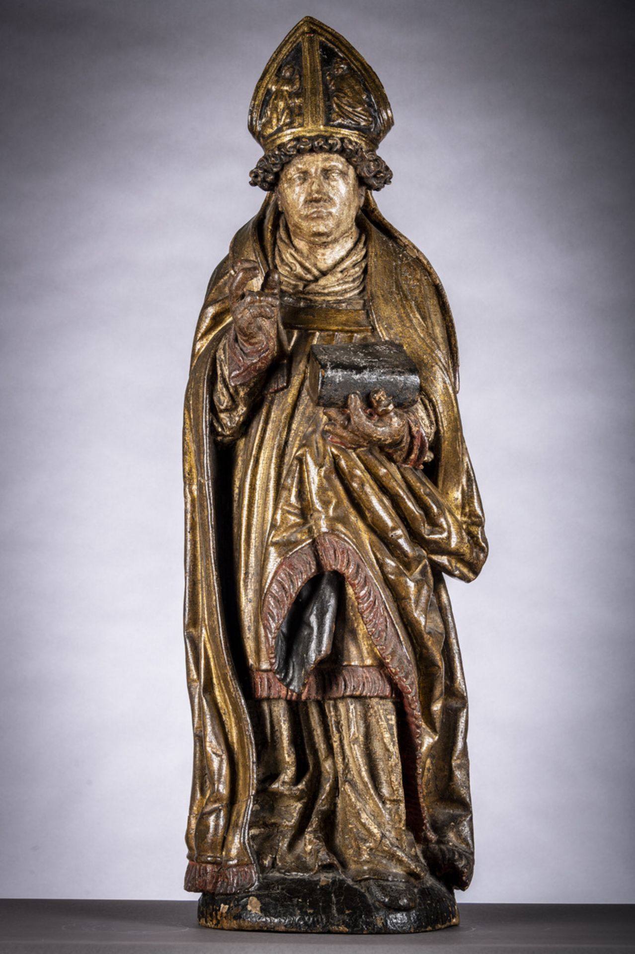 A large polychrome wooden statue of a Bishop (102cm)