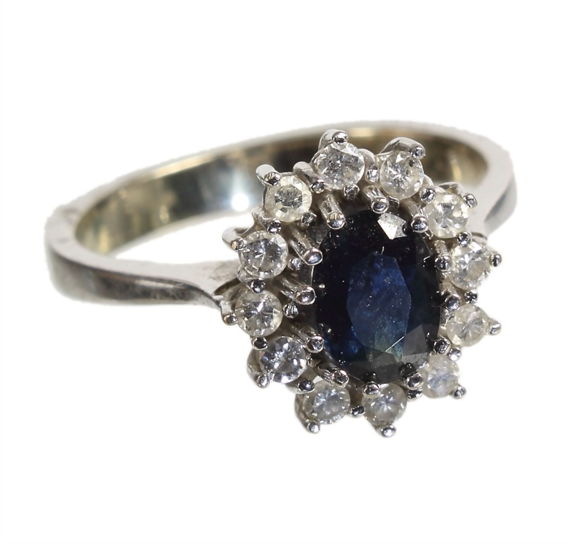 ring, white gold 585/000, central sapphire c. 0.9 ct, 12 brilliants c. 0.19 ct w-si/p, ring width c.