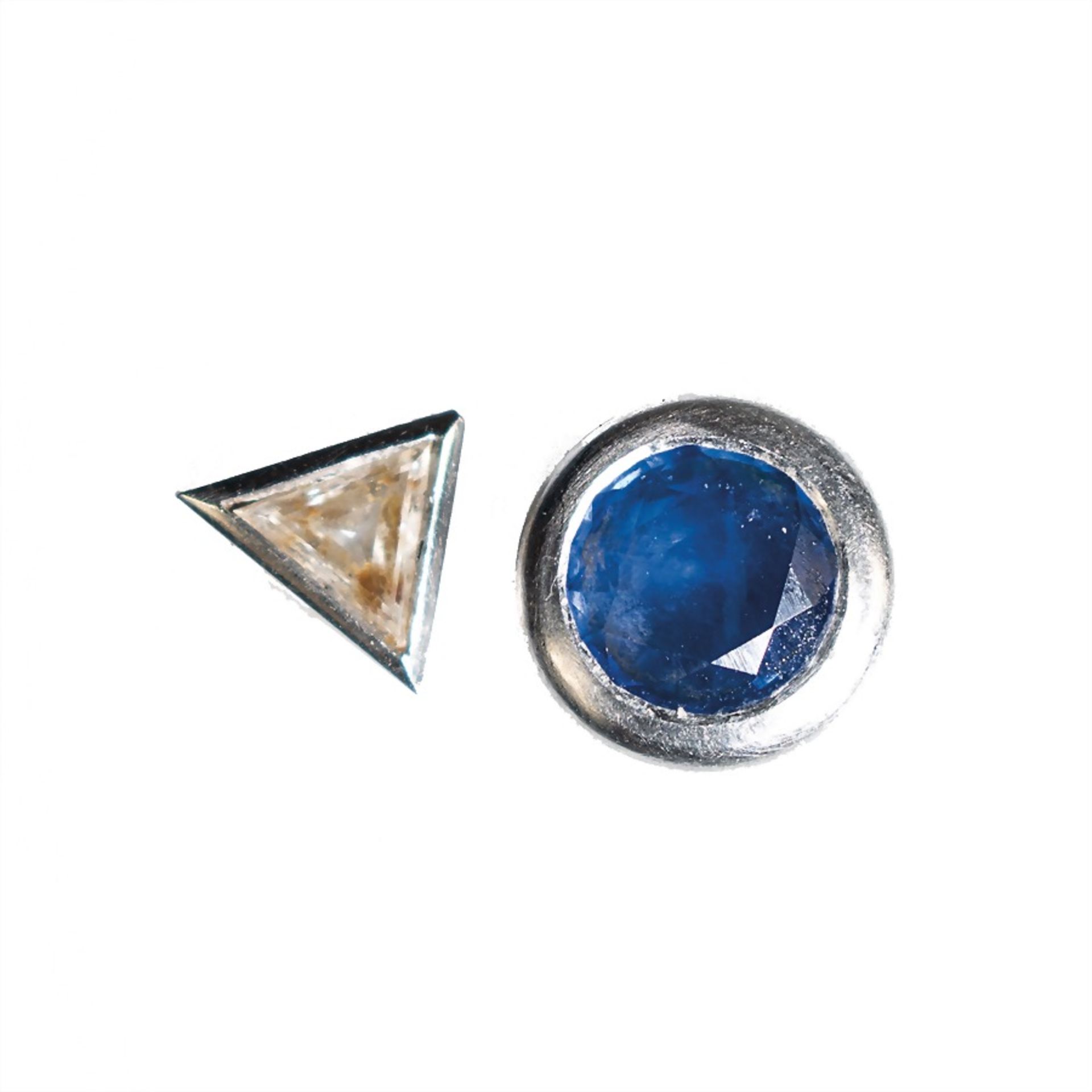 lot: 2 different studs, white gold 585/000, 1 sapphire c. 0,7 ct, 1 colored diamond c. 0.30 ct,