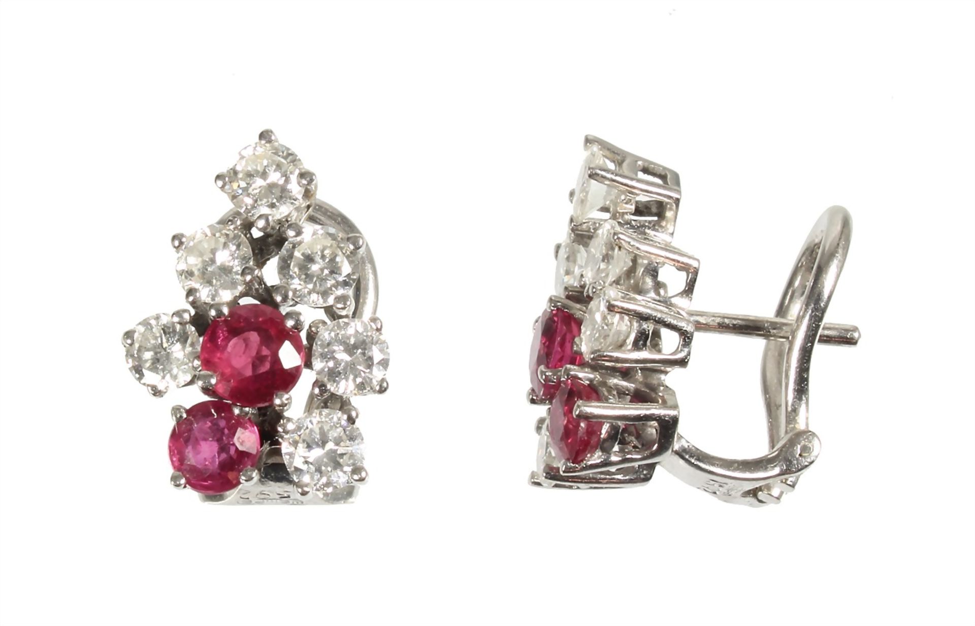 a pair of ear clips with pin, white gold 750/000, 12 brilliants c. 1.64 ct tw-vsi, 4 fine rubies (