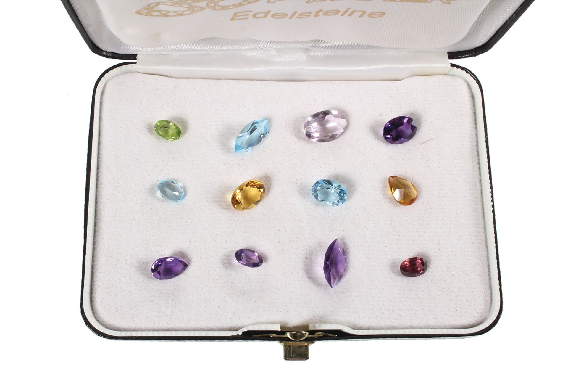 lot: 12 faceted gems, amethysts, citrines, peridot, garnet and topazes, total 18.0 ct, small gem
