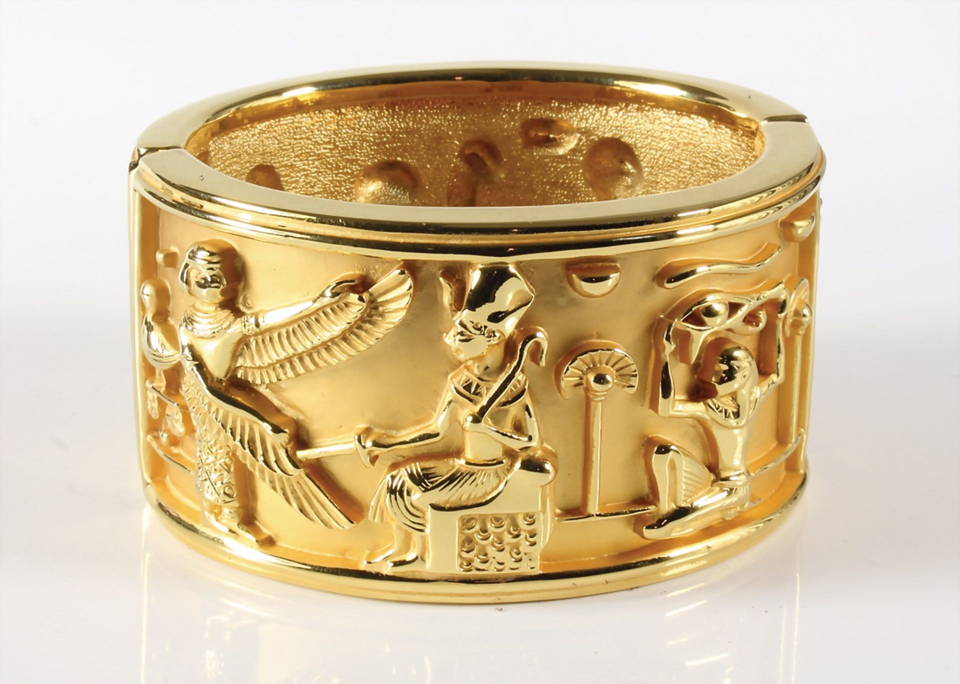 massive Egyptian bangle by "ELISABETH TAYLOR for AVON" (signed), gold colored, relieflike,