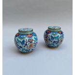 Chine 19ème siècle . Paire de pots couvert en cloisonné à décor de motifs [...]