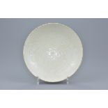 Chinese Dingyao Porcelain Bowl with Incised Lotus Pattern. Coated in a clear creamy-coloured glaze,
