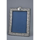 A late 20th Century London Sterling Silver photo frame with stand. Stamped B S C ltd 1994. 27cm x 34