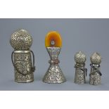 Four Tibetan white metal seals with incensed decoration. 10cm - 17cm tall (4)