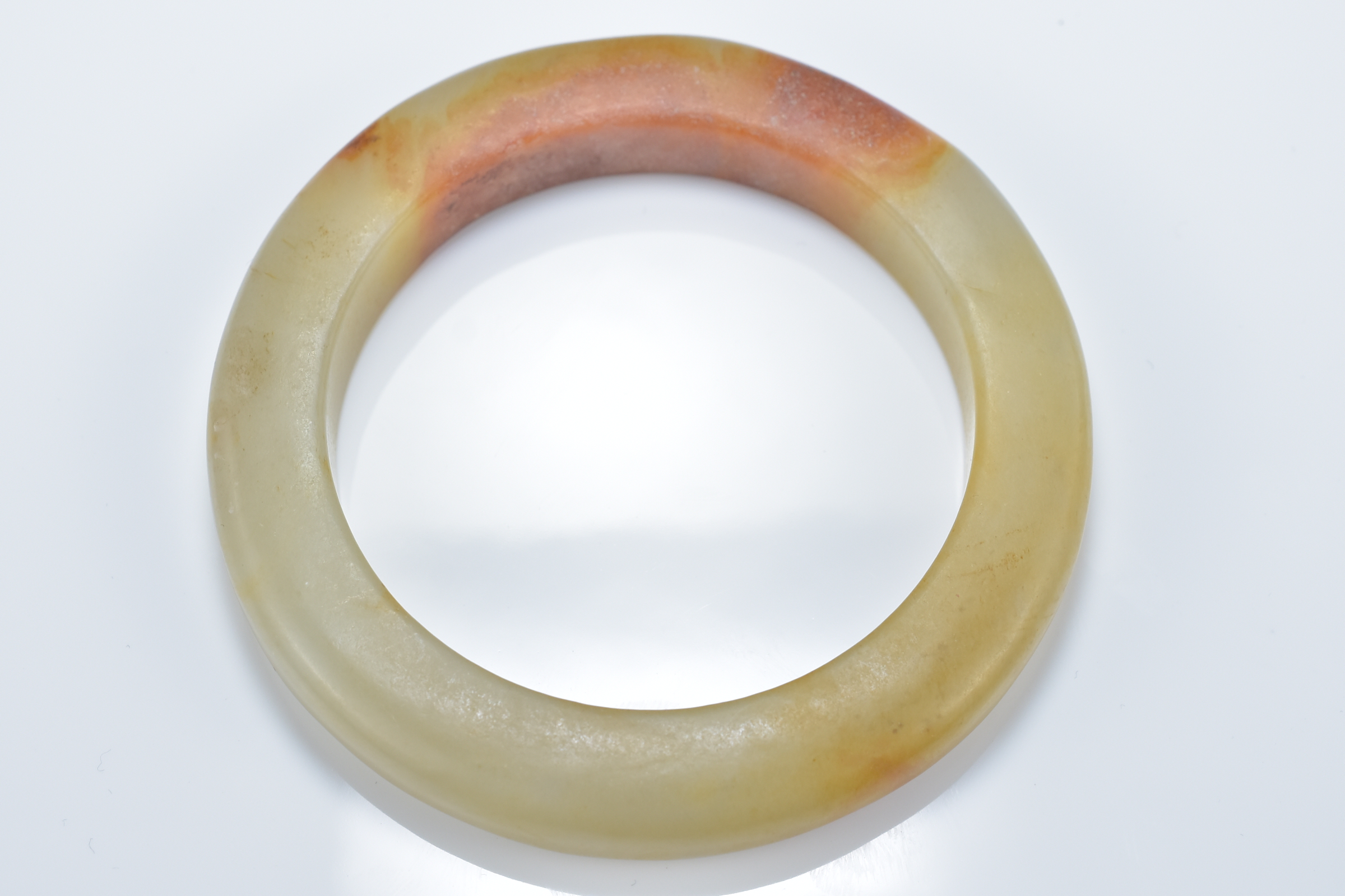 Two Chinese celadon and brown jade bangles. 8.5cm diameter. Inner diameter 6cm. - Image 4 of 4