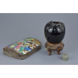 A Chinese porcelain and white metal box and cover decorated with figures. A black glazed porcelain j