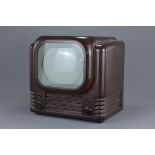 A vintage 1949 Bush mottled brown Bakelite television. 39cm width