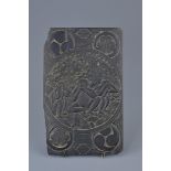 An Asian 19th century or earlier hardwood plaque carved in relief with Monkeys sitting under a tree.