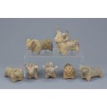 A group of seven miniature painted pottery animal figures. Sizes approx. 9cm to 10cm length (7)