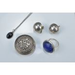 Islamic silver pill box with Arabic inscription, stamped N.U 900, together with a silver lapis stone