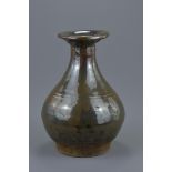 A Chinese Ming dynasty Cizhou ware brown glazed pear-shaped pottery wine bottle. 23.5cm tall