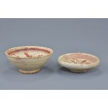 A Chinese Song dynasty Cizhou ware pottery bowl with painted green and red peony decoration together