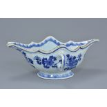 An 18th century Chinese blue and white porcelain sauce boat with twin looped handles decorated with