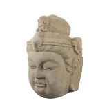 A large Chinese Ming dynasty carved stone head of Guanyin. 23cm x 37cm height