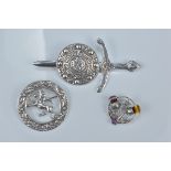 Three Scottish silver brooches, hallmarked Glasgow 1949, 1953 and 1958. (3)