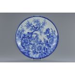 A very large 19th century Japanese blue and white porcelain dish with bird and floral decoration. 47