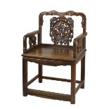 A 19th century Chinese hardwood armchair with animal decorations. Seat size 61cm width