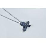 A 14K white gold necklace (stamped 585) with sapphire and single round brilliant cut diamond butterf