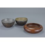 Two Chinese Carved Coconut Tea Cups with metal inserts, 8cms diameter together with a Chinese Hardwo