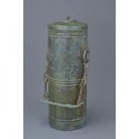 A Chinese Han Dynasty (206BC to 220AD) bronze cylindrical wine vessel with cover and carry handle on