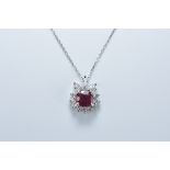 An 18ct white gold necklace stamped 750 with multi diamond and ruby pendant. Ruby size approx. 6mm x