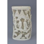 A Chinese late Qing dynasty / Republic period carved ivory vase. Carved with fine open relief scene