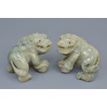 A pair of 19/20th century Asian possibly Chinese carved jadeite lions with ruby eyes. 7cm x 8cm (2)