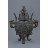 A rare Chinese 'European-style' bronze tripod censer with cover. Elaborately decorated in relief wit