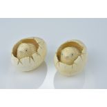 A pair of Japanese 19/20th century carved ivory netsuke of chicks hatching from eggs. (2)