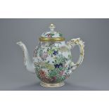 A finely painted early 20th century Japanese porcelain tea pot and cover with floral decoration and