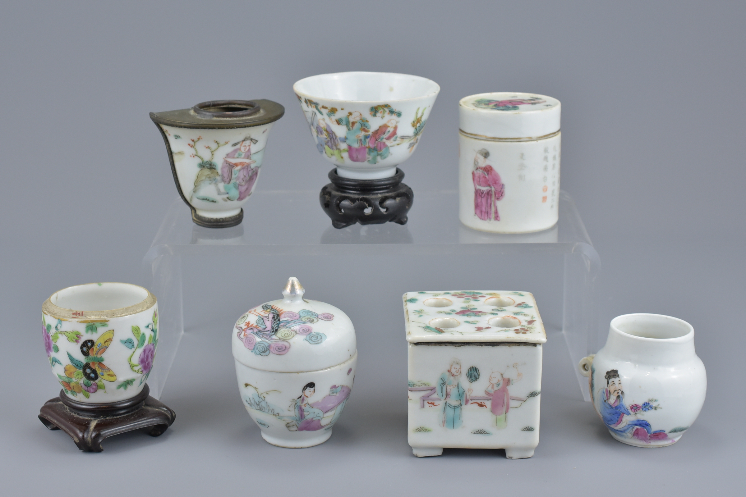 A group of seven Chinese 19th Century Famille Rose porcelain pots, ink pot, cup and bird feeder