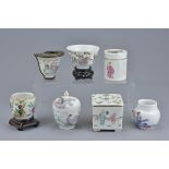 A group of seven Chinese 19th Century Famille Rose porcelain pots, ink pot, cup and bird feeder
