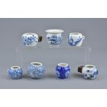 A group of seven Chinese 19/20th Century blue and white porcelain bird feeders