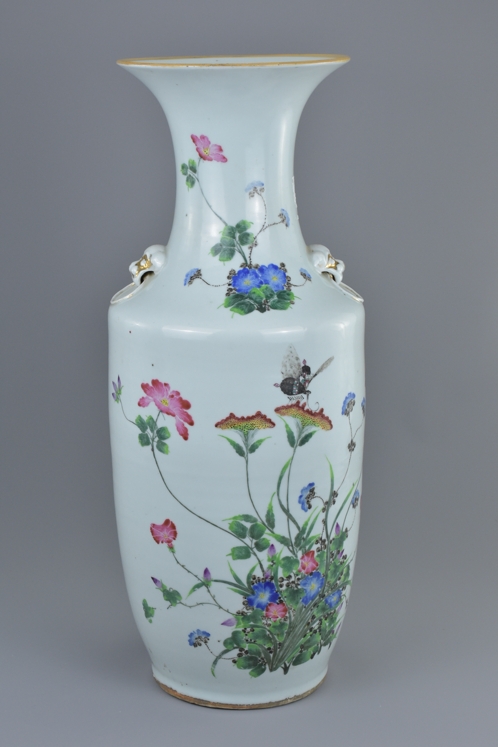 A large Chinese 19th century Famille rose porcelain vase decorated with butterfly amongst flowers an