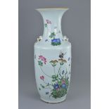 A large Chinese 19th century Famille rose porcelain vase decorated with butterfly amongst flowers an