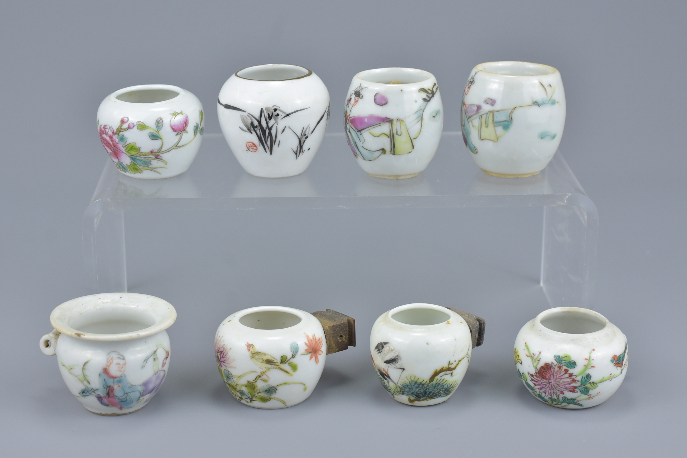 A group of eight Chinese 19/20th Century porcelain bird feeders