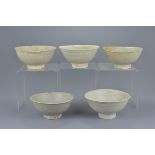 A group of five Chinese Song dynasty white glazed pottery bowls. 16Cm diam. (5)