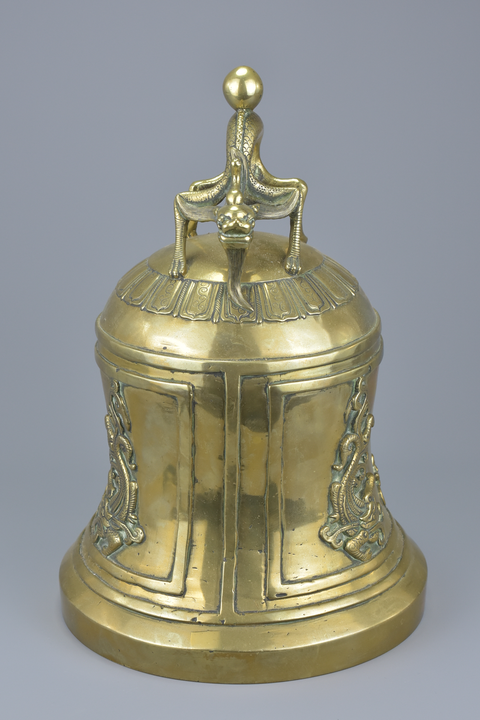 A large Chinese polished bronze bell gong mounted with a dragon handle. 33Cm tall - Image 4 of 6