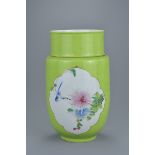 A Chinese 19th century lime green ground porcelain lantern vase with decorative Famille rose panels